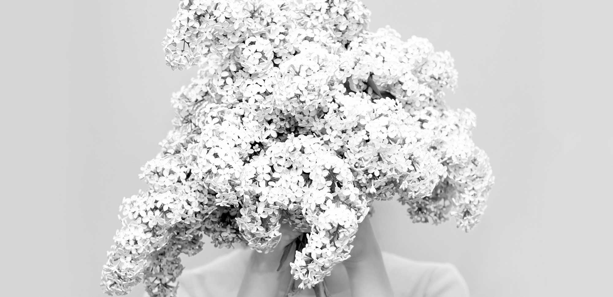 Woman Holding Flowers for Health & Beauty Branding